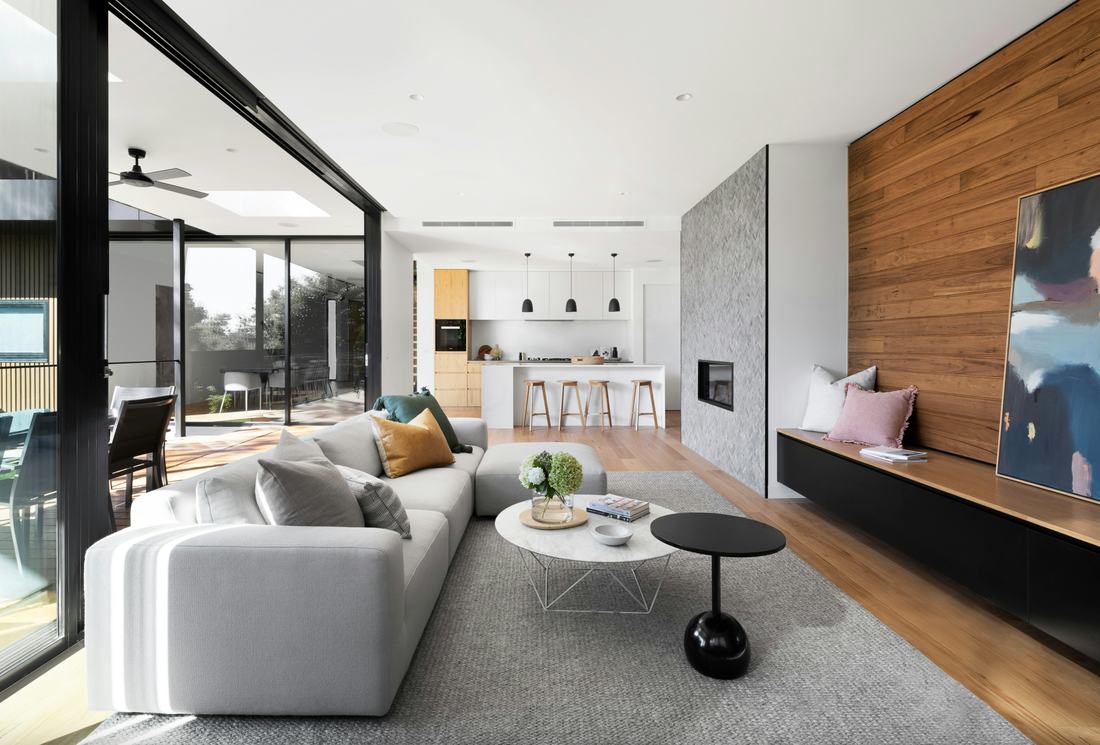 Bright open-plan living space with exposed roof beams