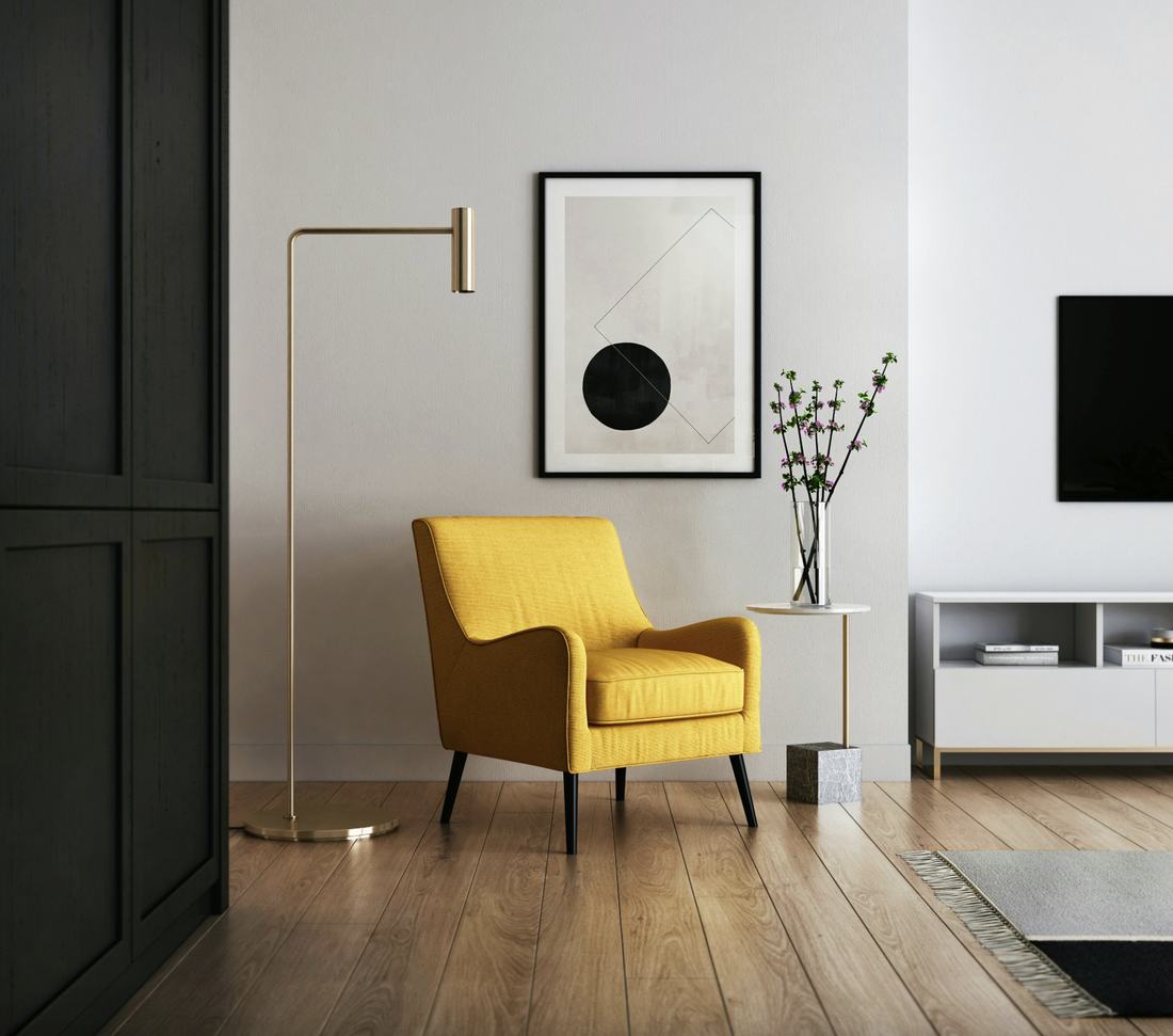 Finished living room with statement armchair and wall art